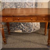 F59. Three-drawer desk with turned legs. 30”h x 45”w x 20 